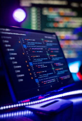 IT business.Monitor closeup of function source code. Project managers work new idea.